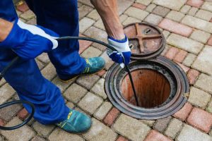 technician preparing hydro jetting equipment